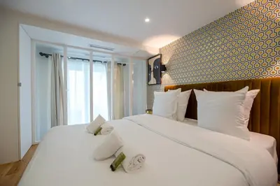 Un ou plusieurs lits dans un hébergement de l'établissement CIA - Spacious Duplex, Grands Boulevards