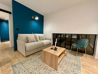Coin salon dans l'établissement Apt 4 Guests Moderne Place Breteuil