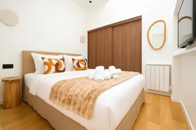 Un ou plusieurs lits dans un hébergement de l'établissement CIA - Elegant Flat Sentier, Grands Boulevards
