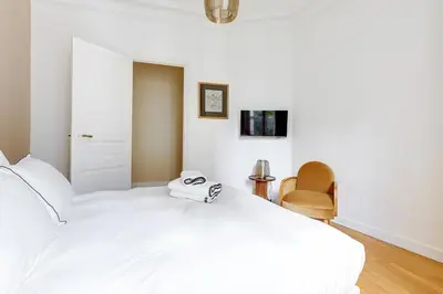 Un ou plusieurs lits dans un hébergement de l'établissement Le Marais Chic by Ecoflats