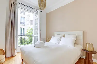 Un ou plusieurs lits dans un hébergement de l'établissement Le Marais Chic by Ecoflats