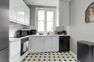 Cuisine ou kitchenette dans l'établissement Le Marais Chic by Ecoflats