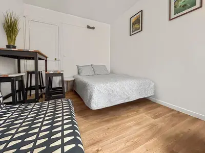 Un ou plusieurs lits dans un hébergement de l'établissement Tiny Studio, proche métro & Stade de France