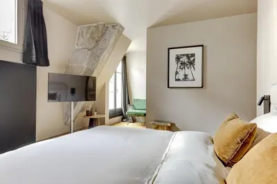 Un ou plusieurs lits dans un hébergement de l'établissement Vendome 2bd