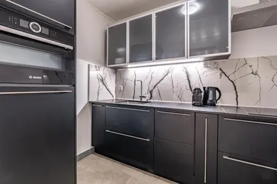 Cuisine ou kitchenette dans l'établissement La Suite des Ternes