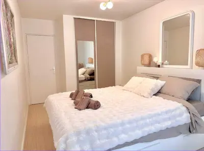 Un ou plusieurs lits dans un hébergement de l'établissement Appart Hotel Paris Cosy Apartment Paris 12eme Gare de Lyon Bercy