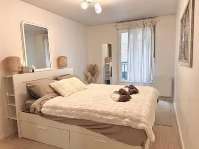 Un ou plusieurs lits dans un hébergement de l'établissement Appart Hotel Paris Cosy Apartment Paris 12eme Gare de Lyon Bercy