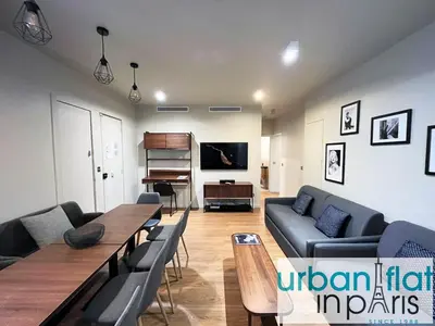 Télévision ou salle de divertissement dans l'établissement Urban Flat 78 - 3 Bedroom apartment Republique