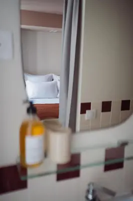 Un ou plusieurs lits dans un hébergement de l'établissement LALA Hôtel