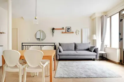 Coin salon dans l'établissement Cozy Apartment 2BR 6P - Boulets Nation