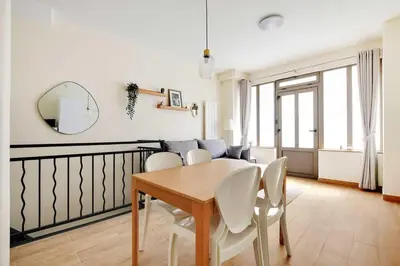 Coin salon dans l'établissement Cozy Apartment 2BR 6P - Boulets Nation