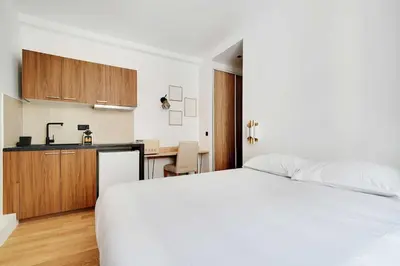 Un ou plusieurs lits dans un hébergement de l'établissement Studio-Suite 4 stars, 15m from Eiffel, Refined