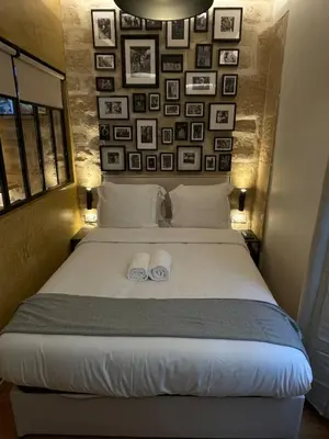 Un ou plusieurs lits dans un hébergement de l'établissement Cozy Loft Montmartre Place des Abbesses Sacré Cœur