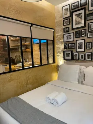 Un ou plusieurs lits dans un hébergement de l'établissement Cozy Loft Montmartre Place des Abbesses Sacré Cœur