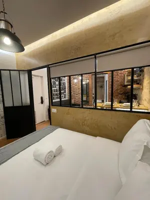 Un ou plusieurs lits dans un hébergement de l'établissement Cozy Loft Montmartre Place des Abbesses Sacré Cœur