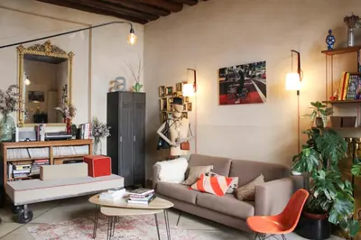 Coin salon dans l'établissement Apartment with garden near Place de la Nation