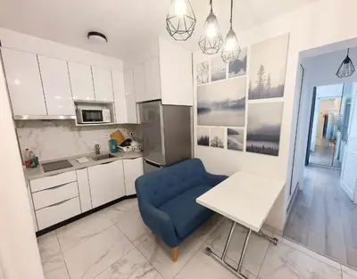 Cuisine ou kitchenette dans l'établissement Marais Side Apartment Paris 11e