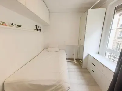 Un ou plusieurs lits dans un hébergement de l'établissement Marais Side Apartment Paris 11e