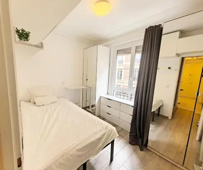 Un ou plusieurs lits dans un hébergement de l'établissement Marais Side Apartment Paris 11e