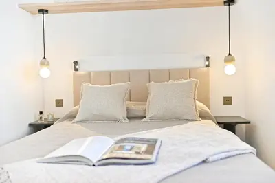 Un ou plusieurs lits dans un hébergement de l'établissement Élégant esprit suite d'hôtel