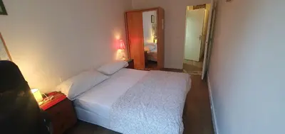 Un ou plusieurs lits dans un hébergement de l'établissement Appartement au cœur de Paris