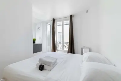 Un ou plusieurs lits dans un hébergement de l'établissement 2 pieces cosy hopital bichat - paris 18 - 2P
