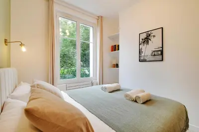 Un ou plusieurs lits dans un hébergement de l'établissement Calm Square Flat