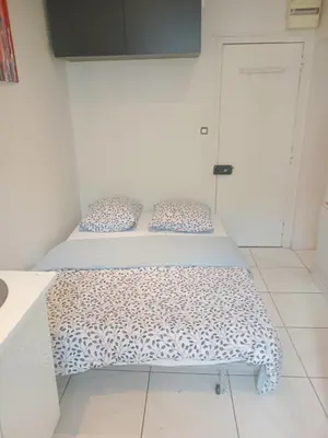 Un ou plusieurs lits dans un hébergement de l'établissement Chambre proche centre ville