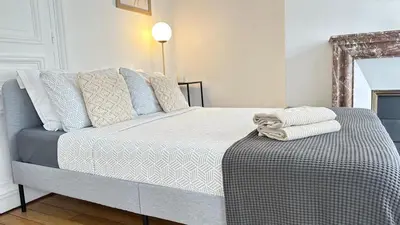 Un ou plusieurs lits dans un hébergement de l'établissement Suite 140m2 vue sur Tour Eiffel