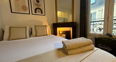 Un ou plusieurs lits dans un hébergement de l'établissement Suite 140m2 vue sur Tour Eiffel