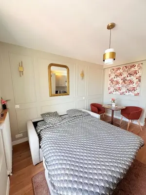 Un ou plusieurs lits dans un hébergement de l'établissement Studio Prestige Paris Porte de Versailles