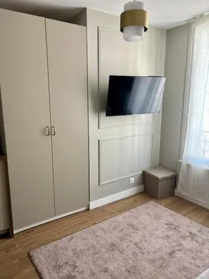 Télévision ou salle de divertissement dans l'établissement Studio Prestige Paris Porte de Versailles