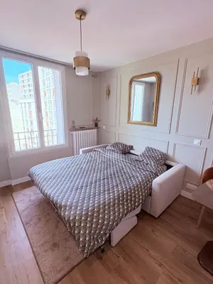 Un ou plusieurs lits dans un hébergement de l'établissement Studio Prestige Paris Porte de Versailles