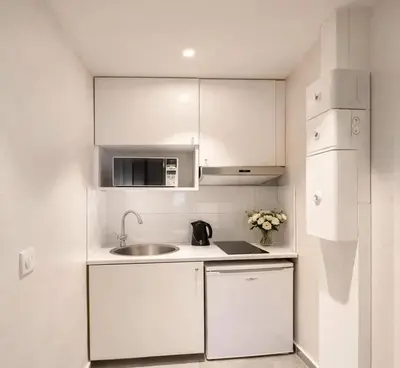 Cuisine ou kitchenette dans l'établissement Arc de Triomphe - Premium family apartment for 5