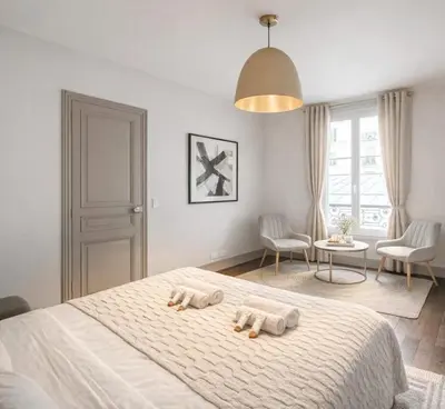 Un ou plusieurs lits dans un hébergement de l'établissement Arc de Triomphe - Premium family apartment for 5