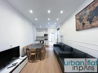 Coin salon dans l'établissement Urban Flat 35 - 2 Bedroom Apartment Grands Boulevards