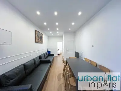 Coin salon dans l'établissement Urban Flat 35 - 2 Bedroom Apartment Grands Boulevards