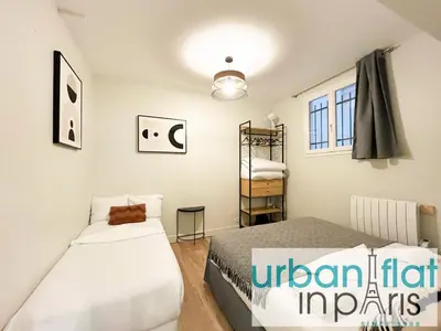 Un ou plusieurs lits dans un hébergement de l'établissement Urban Flat 07 - Opera Grands Boulevards Flat