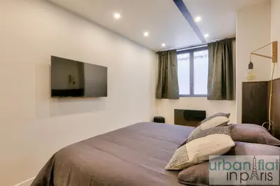 Un ou plusieurs lits dans un hébergement de l'établissement Urban Flat 170 - Amelot Apartment in Center of Paris