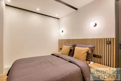 Un ou plusieurs lits dans un hébergement de l'établissement Urban Flat 170 - Amelot Apartment in Center of Paris