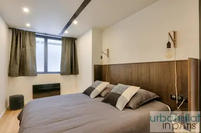 Un ou plusieurs lits dans un hébergement de l'établissement Urban Flat 170 - Amelot Apartment in Center of Paris