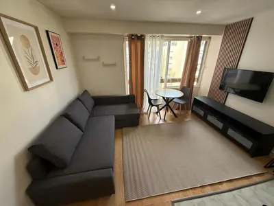 Coin salon dans l'établissement Cozy Studio Ideally Located
