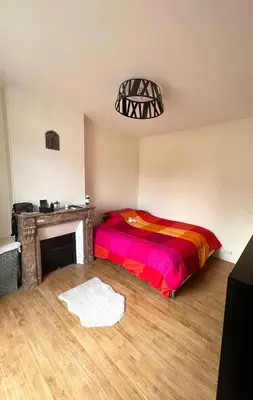 Un ou plusieurs lits dans un hébergement de l'établissement Appartement Saint Ferdinand