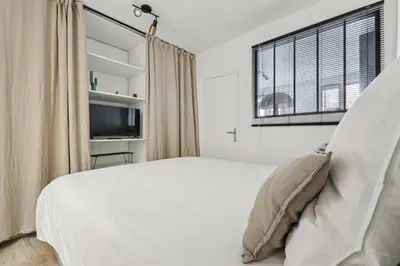 Un ou plusieurs lits dans un hébergement de l'établissement Apartment in Paris 2ème