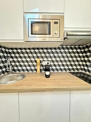 Cuisine ou kitchenette dans l'établissement Studio by Eiffel Tower and Roland Garros