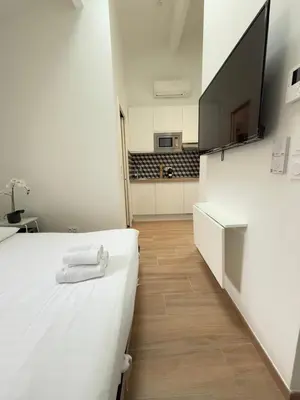Un ou plusieurs lits dans un hébergement de l'établissement Studio by Eiffel Tower and Roland Garros
