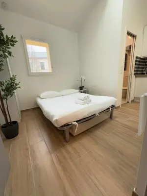 Un ou plusieurs lits dans un hébergement de l'établissement Studio by Eiffel Tower and Roland Garros