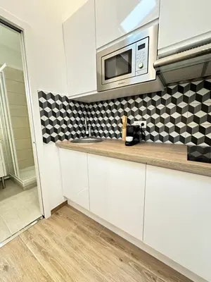 Cuisine ou kitchenette dans l'établissement Studio by Eiffel Tower and Roland Garros