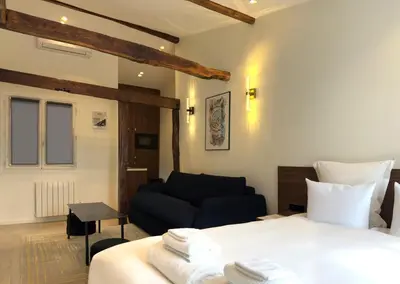 Un ou plusieurs lits dans un hébergement de l'établissement Luxury Suite, Montaigne & Champs Elysées