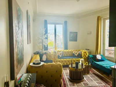 Coin salon dans l'établissement Appartement NY in Paris with love